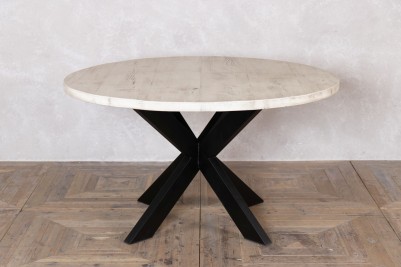 round-dining-table-with-vintage-tank-trap-base